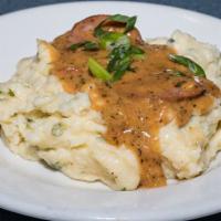 Jalapeno Cheese Grits · Creamy jalapeno cheese grits topped with andouille sausage gravy. (Contains Pork)