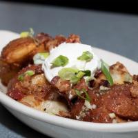 Loaded Red Potatoes · Crispy red potatoes loaded with melted garlic butter, bacon, sour cream, and green onions. (...