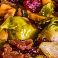 Roasted Brussels Sprouts · Seasoned and roasted Brussels sprouts mixed with roasted carrots, bacon, and cranberries sau...