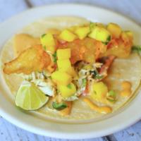 Baja Fish Taco · Beer-battered fish with spicy slaw, mango salsa, and special sauce. Served on soft corn tort...