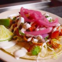 Chipotle Pork Taco · Slow-cooked pork in chipotle sauce with pickled red onions, pico de gallo and sour cream. Se...