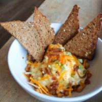 Hangover Bowl · breakfast potatoes topped with scrambled eggs, Meemom's Italian sausage gravy, cheddar jack,...