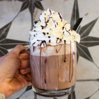 Mom & Dad's Hot Chocolate · White chocolate, dark chocolate, and steamed milk. topped with whipped cream.