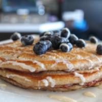 Honey Blue Blue · Waffles or Pancakes. Topped with fresh blueberries, honey and powdered sugar. drizzled with ...
