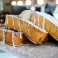Churro · Coated in cinnamon sugar. topped with cream cheese glaze and powdered sugar. drizzled with v...
