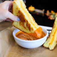 Country Lunch · Traditional grilled cheese served on thick cut challah bread. served with cup of tomato soup.