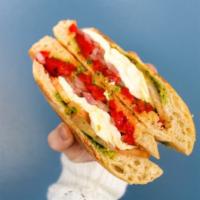 Caprese Panini · Fresh mozzarella, tomatoes, pickled red onions, roasted red peppers and pesto. served with a...