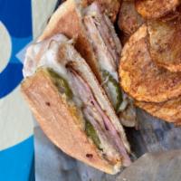 Cubano · Grilled turkey, grilled ham, Swiss, honey mustard and pickles.