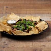 Lucky 7 Layer Dip  · Ground beef, refried beans, cheese, tomato, black olives, sour cream and jalapenos. Served w...