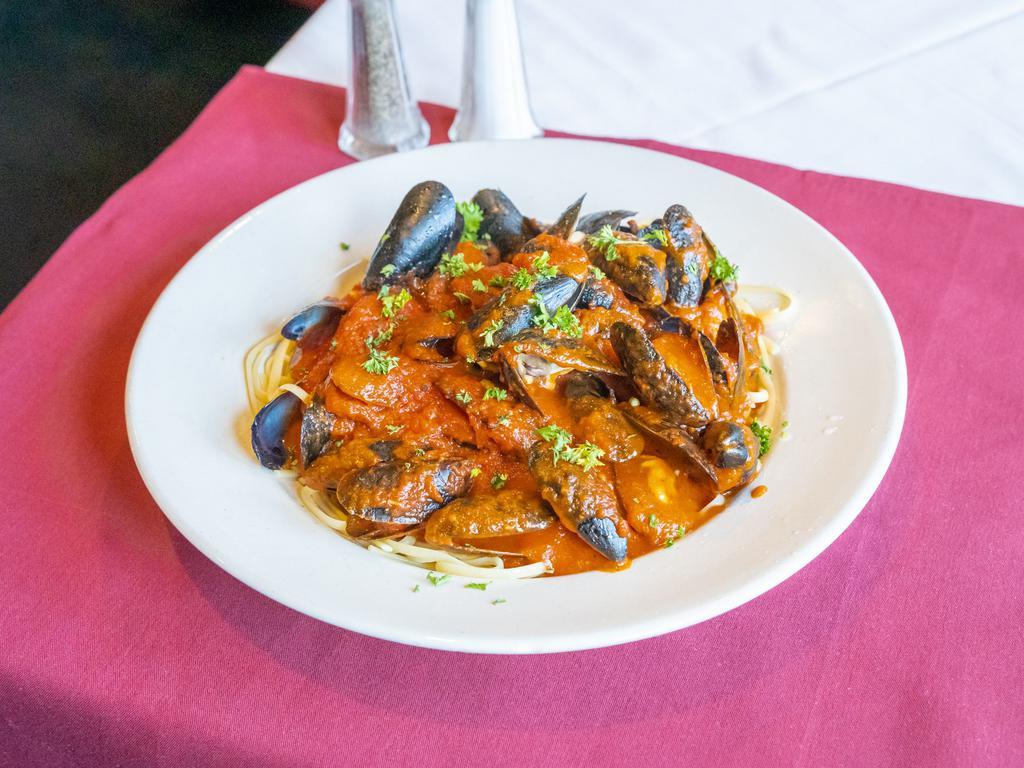 Linguini with Clams · Little neck clams tossed with linguini pasta in a zesty marinara or garlic white clam sauce