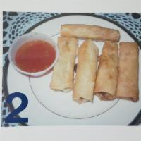 2. Egg Rolls · Deep-fried rolls stuffed with mix vegetables, served with sweet and sour sauce. 4 rolls. 