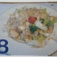 8. Fried Rice · Fried rice with egg, onion, broccoli, peas and carrot.