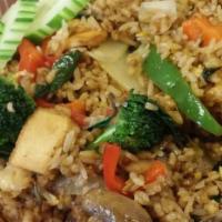 9. Basil Fried Rice · Fried rice with egg, onion, bell pepper, crushed fresh chili, broccoli, basil, and mushrooms.