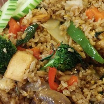 9. Basil Fried Rice · Fried rice with egg, onion, bell pepper, crushed fresh chili, broccoli, basil, and mushrooms.