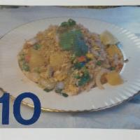 10. Pineapple Fried Rice · Fried rice with egg, onion, peas, carrot, pineapple, cashew nuts, and broccoli.