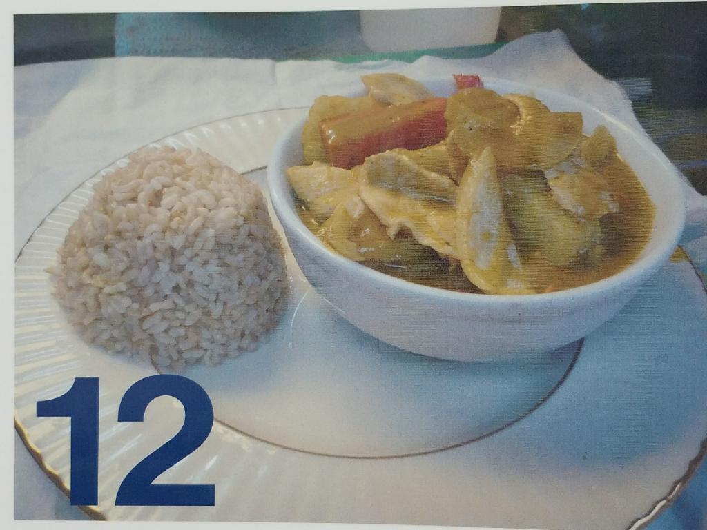 12. Yellow Curry · Yellow curry in coconut milk with potato, carrot, onion and bell pepper.