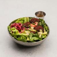 Falafel Salad · Romaine lettuce protein, pita, sauce and toppings. Vegan.