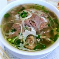 P2. Special Pho · Steak, tendons, fat brisket, flank tripe, and meatballs in a clear beef broth.