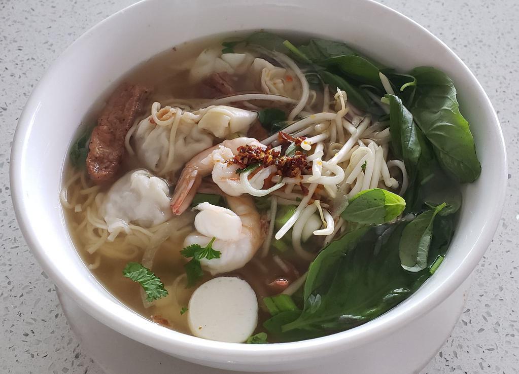 N2. Wonton and Seafood with Egg Noodle Soup · Broth and noodles from from wheat and eggs. 
