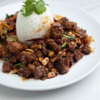 Kung Pao Chicken · Spicy soy ginger glaze and Sambal chili tossed with chicken, green onions, peanuts, dried re...