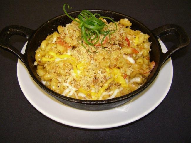 Spicy Sausage Mac and Cheese · Cavatappi pasta sautéed with Parmesan cream sauce, spicy Italian sausage, red pepper, Swiss, and cheddar & jack cheeses. Topped with breadcrumbs and baked till golden brown.