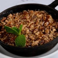 Whiskey Apple Crumble · Whiskey glazed Granny Smith apples, baked with a cinnamon-pecan
streusel topping with salte...