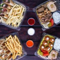 Shawarma Arabi Family Meal with 2 Meats عدد ٣ جكن عربي ·  4 Orders of our famous shawarma Arabi with your choice of meat warped in tortilla bread. Cu...