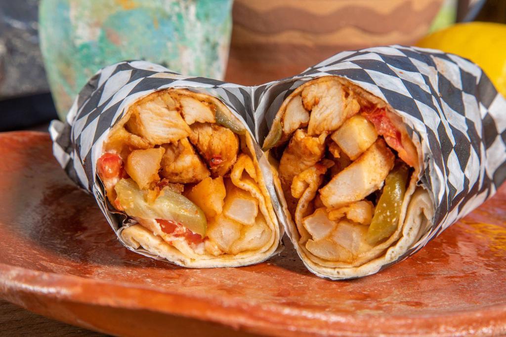  9. BBQ chicken Wrap  دجاج صــــاج · Marinated chicken, mediterranean spices, lettuce, tomato, onion pickles & garlic sauce.