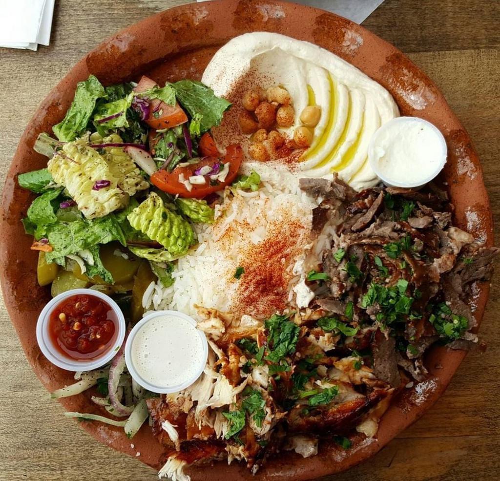 22. Beef Shawarma Plate صحن بيف · Marinated beef, served with rice, mix salad, tzatziki, hummus, and choice of sauce.