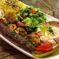 27. Kafta Kabab over Rice Plate  · Ground beef with chopped onion & parsley seasoned with a blend of spices, rice, mix salad, t...