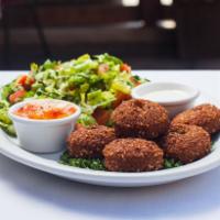 32. Falafel over Salad فلافل مع السلطة · Salad with fried balls made from beans. 