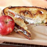 Moscone Sandwich · fresh mozzarella, fontina, lavender-basil pesto, olive-tapenade, tomatoes, garlic butter on ...