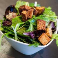 Organic Mixed Greens Salad · Tossed in champagne vinaigrette dressing.
