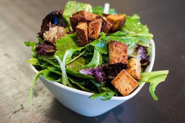 Organic Mixed Greens Salad · Tossed in champagne vinaigrette dressing.