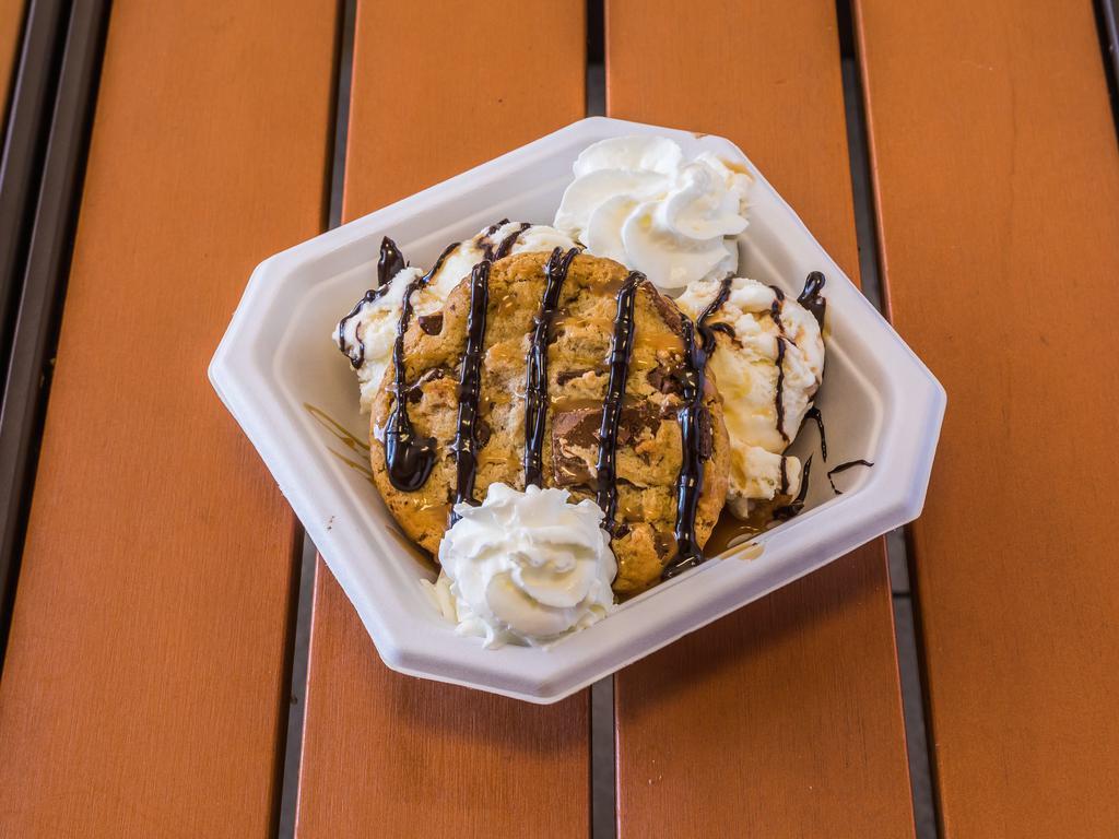 Warm Brownie Sundae · A rich homemade chocolate brownie warmed to order, topped with pecans, vanilla ice cream, drizzled with hot fudge, caramel and creamy whipped topping.