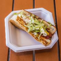 Sonoran Style Hot Dog · Fresh guacamole, diced tomato, mayo, mustard, ketchup, bacon, Cotija, grilled onions, jalape...