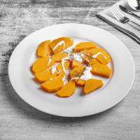 Kadoo · Butternut squash. Cooked with herbs and topped with yogurt and mint.