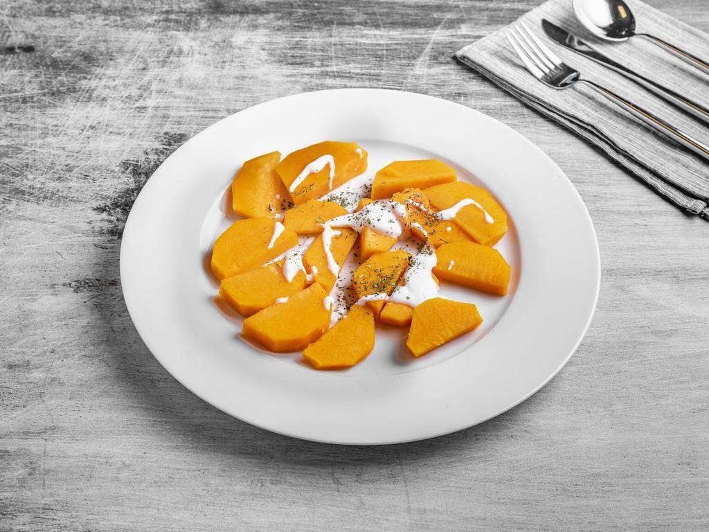 Kadoo · Butternut squash. Cooked with herbs and topped with yogurt and mint.
