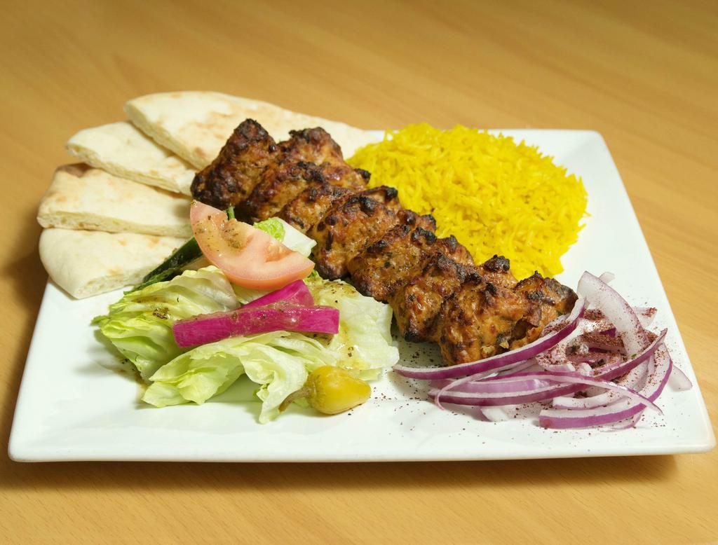 Ground Chicken Kabob Plate · Fresh ground chicken blended with onions, fresh garlic, parsley, and house spices. Served with yellow rice, homemade salad, and pita bread.