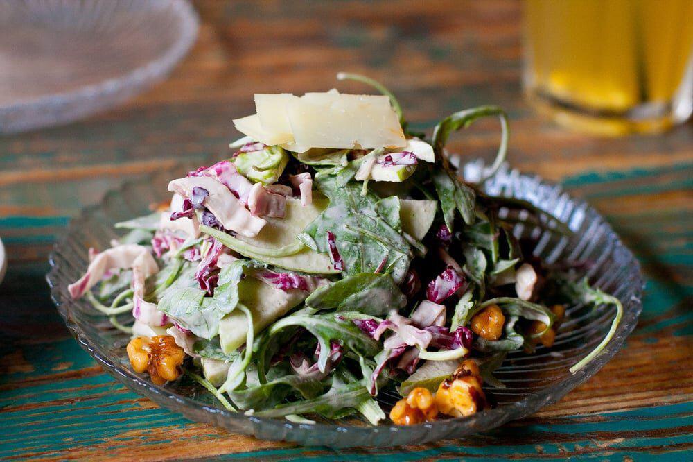 Ensalada de Manzana Dinner · Granny Smith apple salad, radicchio, arugula, candied walnuts, shaved manchego 
cheese, apple cider vinaigrette.
