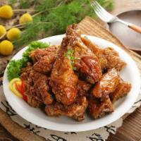 Soy Garlic Wings (간장마늘윙) · Crispy fried chicken wings with soy garlic sauce.