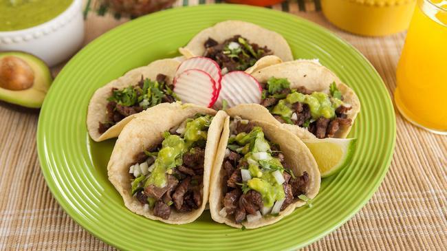 Taco · A handmade tortilla, meat, cilantro, and onion.