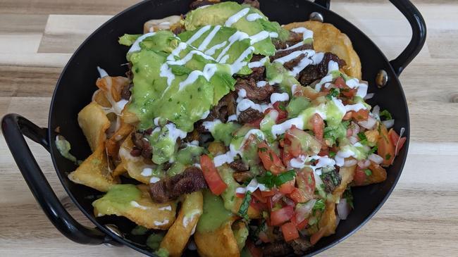 Carne Asada Fries · Your choice of meat, cheese, pico de gallo, sour cream, avocado and our famous avocado salsa piled on seasoned french fry potatoes