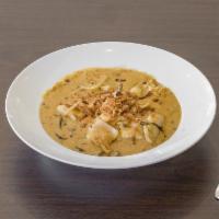 Coconut Curry · You choice of meat stir-fried with onions and mushrooms in a savory coconut curry sauce topp...