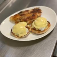 Eggs Benedict · 2 poached eggs with Canadian bacon on toasted English muffin with hollandaise sauce.