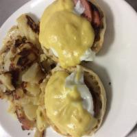 Salmon Benedict · 2 poached eggs with smoked salmon on toasted English muffin with hollandaise sauce.