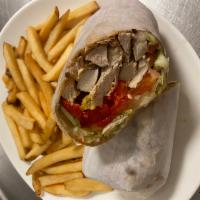 Veggie Wrap · Grilled portabello mushrooms, roasted red peppers, mozzarella, lettuce, and tomato with bals...