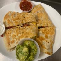 Chicken Quesadilla · Flour tortillas with grilled chicken, mozzarella cheese, chopped jalapenos, red and green pe...