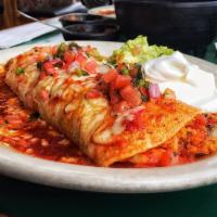 Macho Burrito · A flour tortilla filled with rice, beans, and your choice of ground beef, chicken, picadillo...