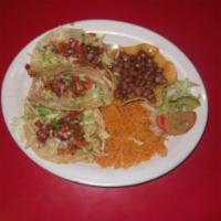 Tacos de Pescada · 3 soft homemade corn tortilla filled with a Tilapia fish, lettuce, pico de gallo, and a spec...